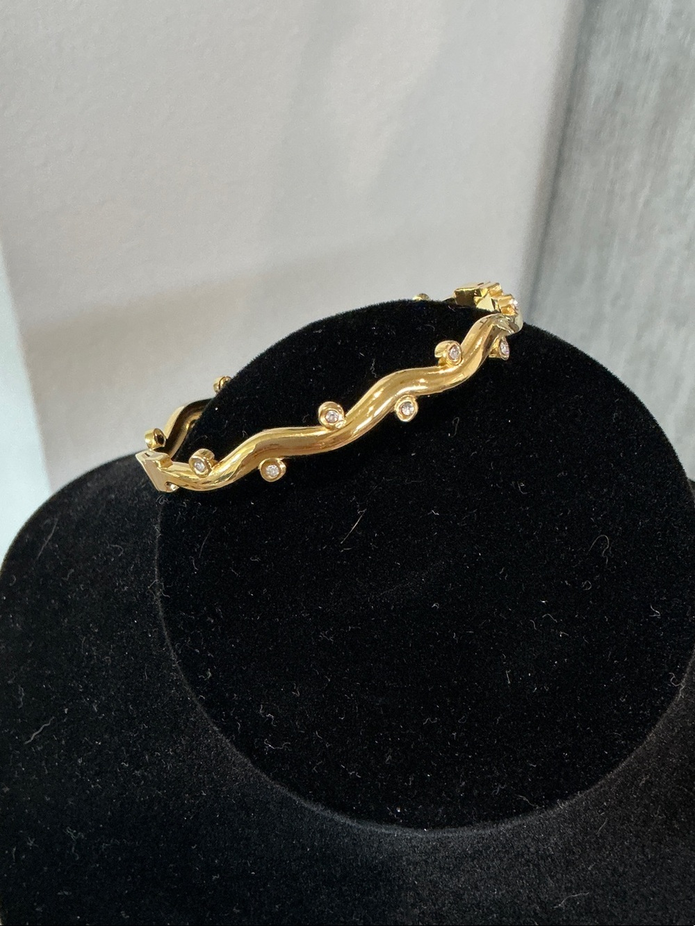 Gold Wave Crystal Accent Bangle Bracelet